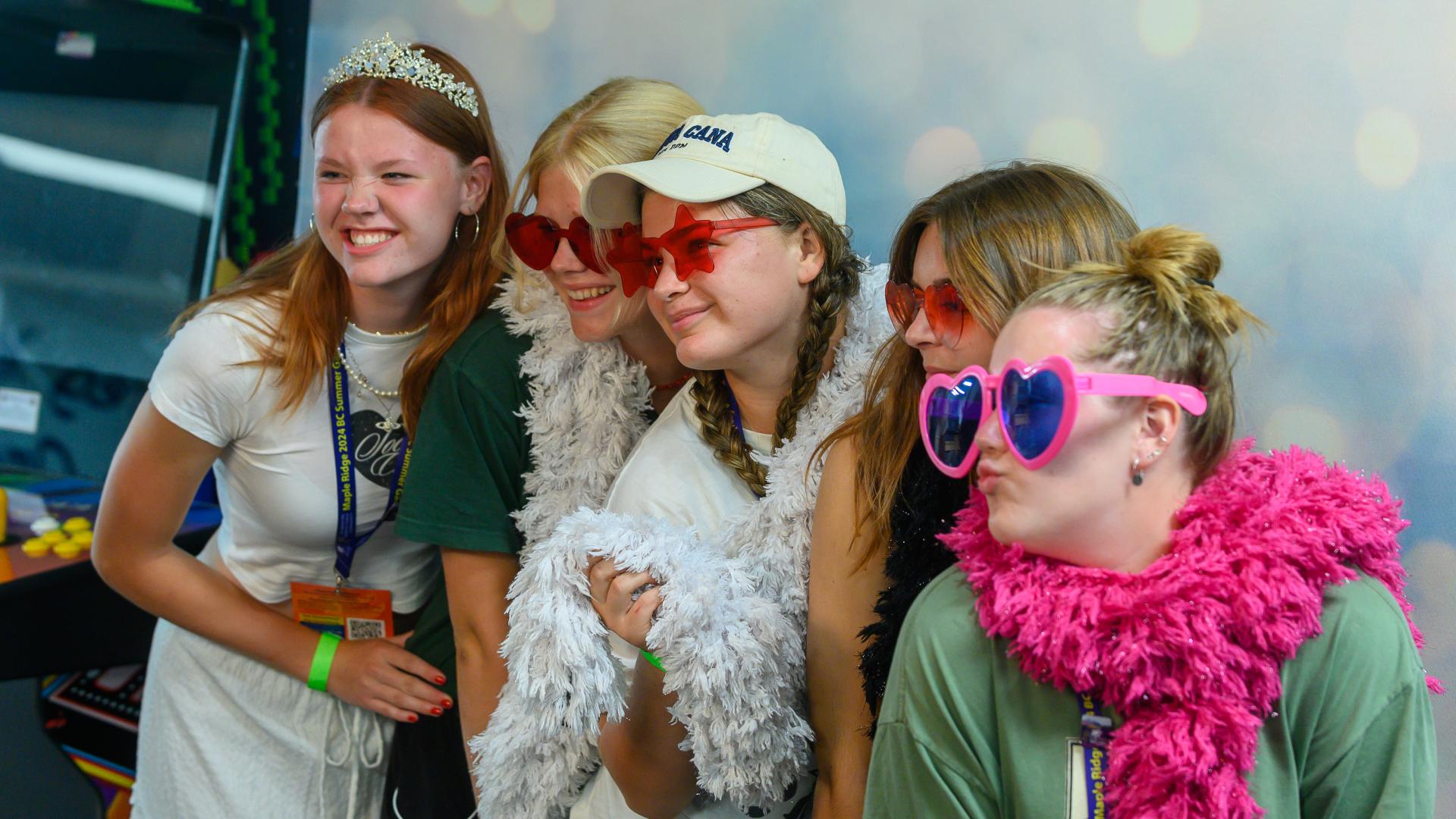 Group of Youth Girls Taking a Photo with Props Together