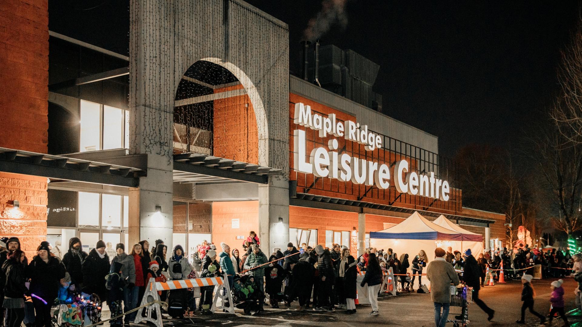 A crowd watches the annual Christmas Parade outside the Maple Ridge Leisure Centre.
