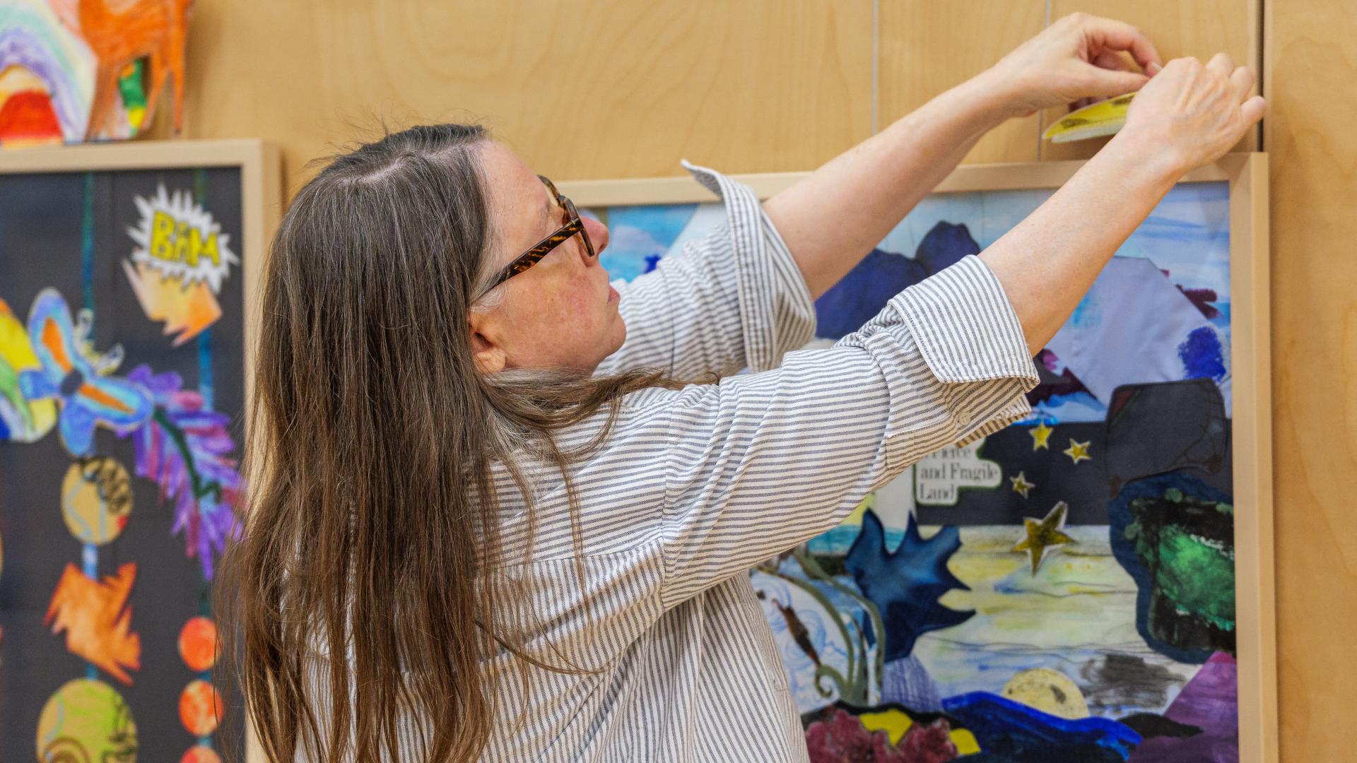 Colleen Brown sets the finishing touches on River Weather Variable.