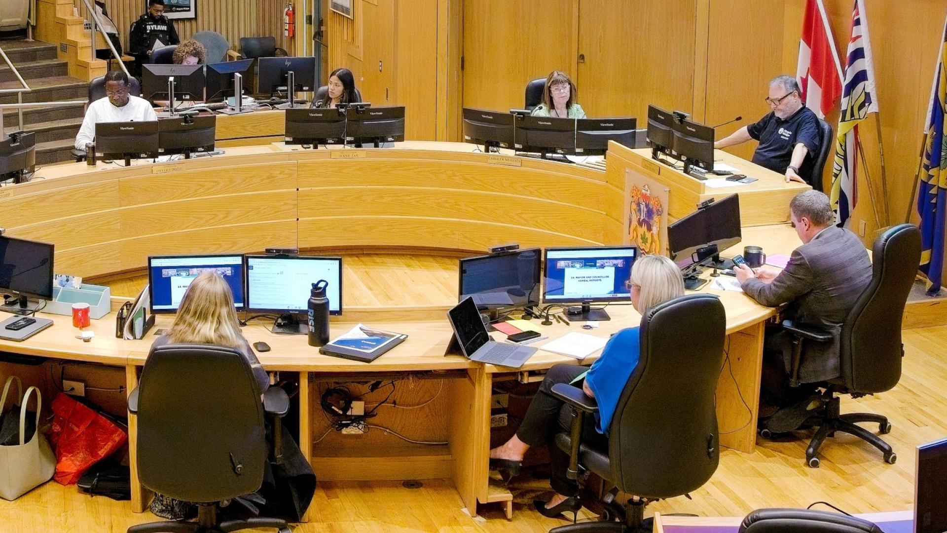 The 2022-2026 Maple Ridge Council discussed an issue in Council Chambers.