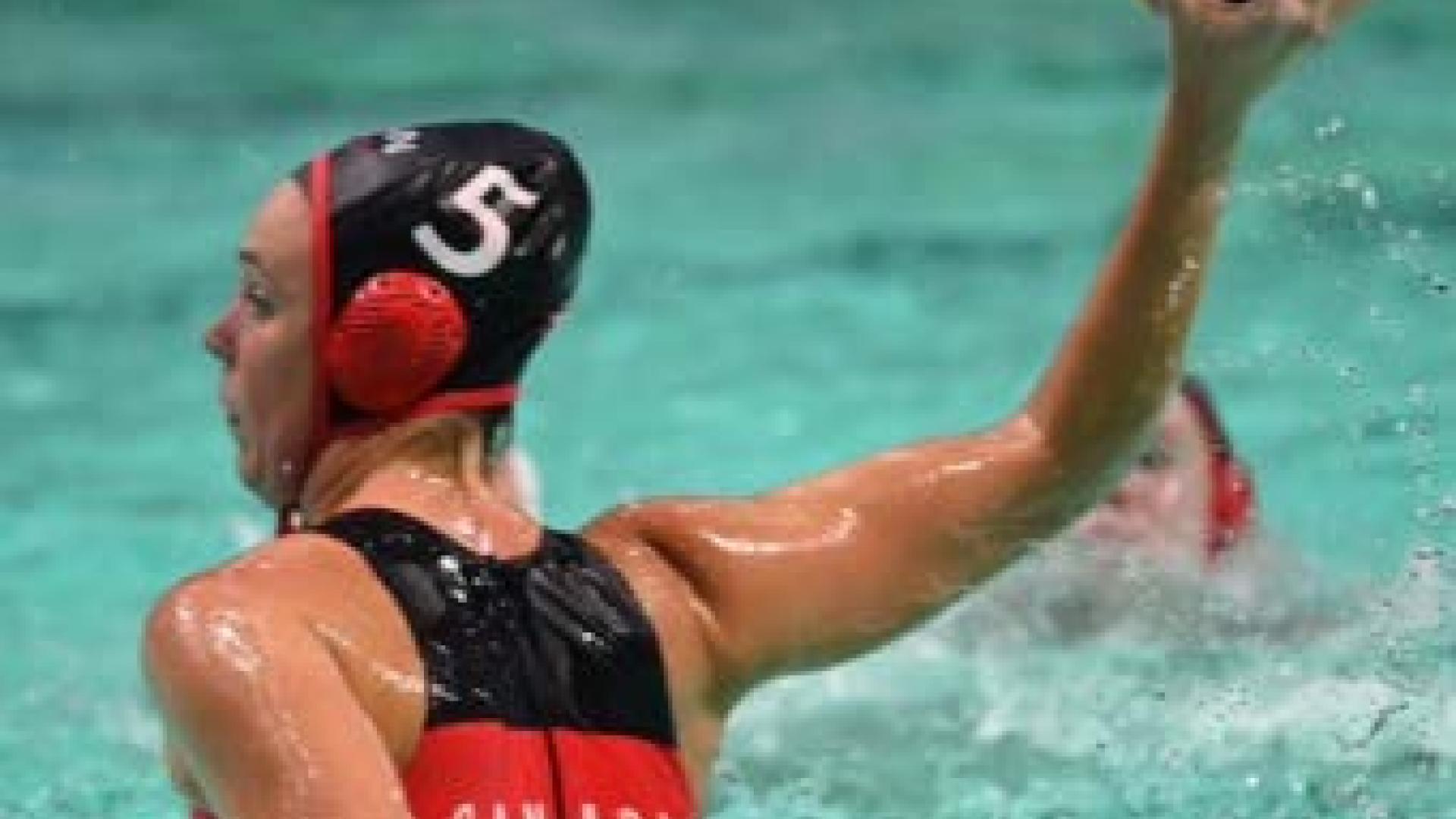 Monika Eggens winds up to throw a watersport ball in the pool.