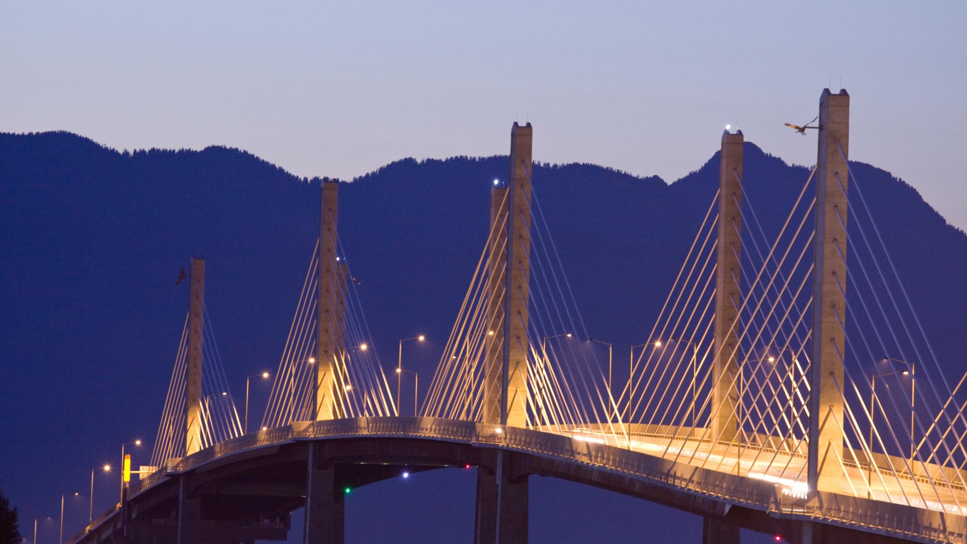 The Golden Ears Bridge stands well-illuminated after the sun sets.