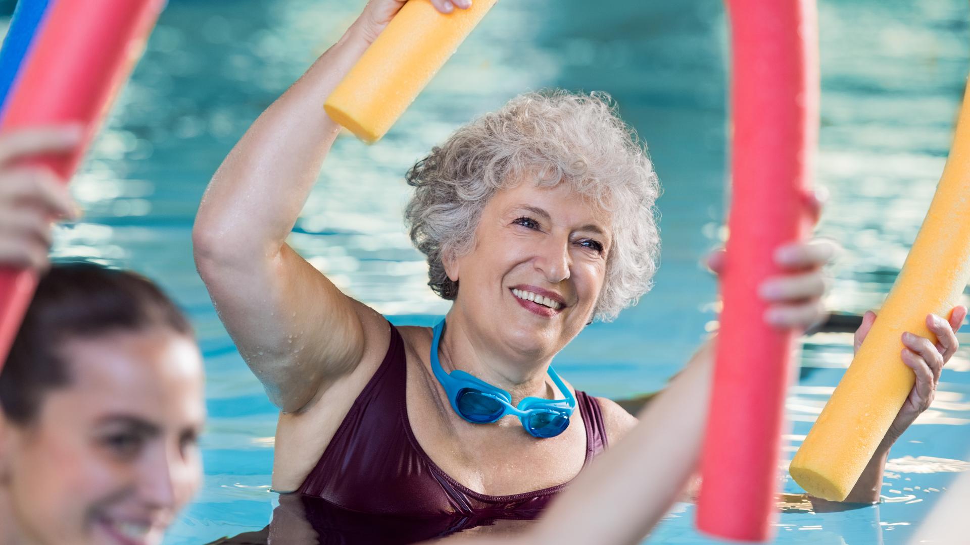 Women in the Pool Participating in an Aqua Fitness Class
