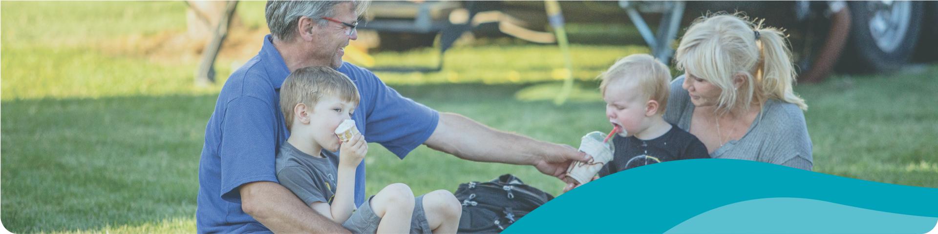 family enjoying ice cream outside