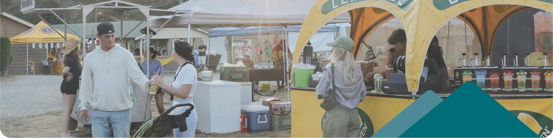 people near lemonade stand