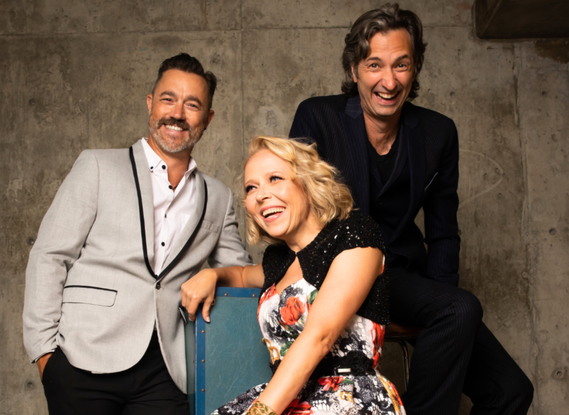 The main cast of the Comedy Department's My Funny Valentine rests in chairs against a concrete background.