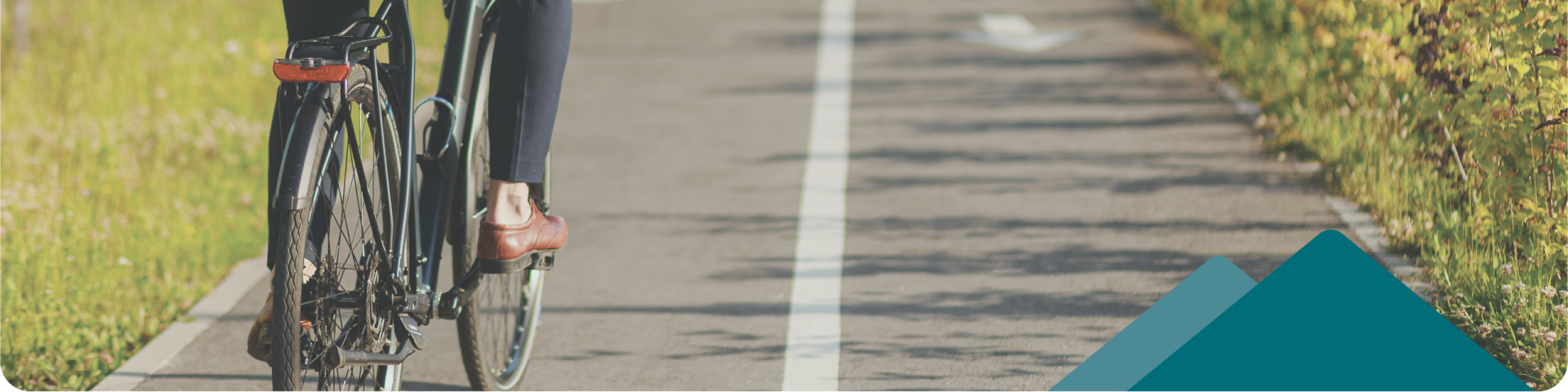 man on a bicycle riding on a bicycle path